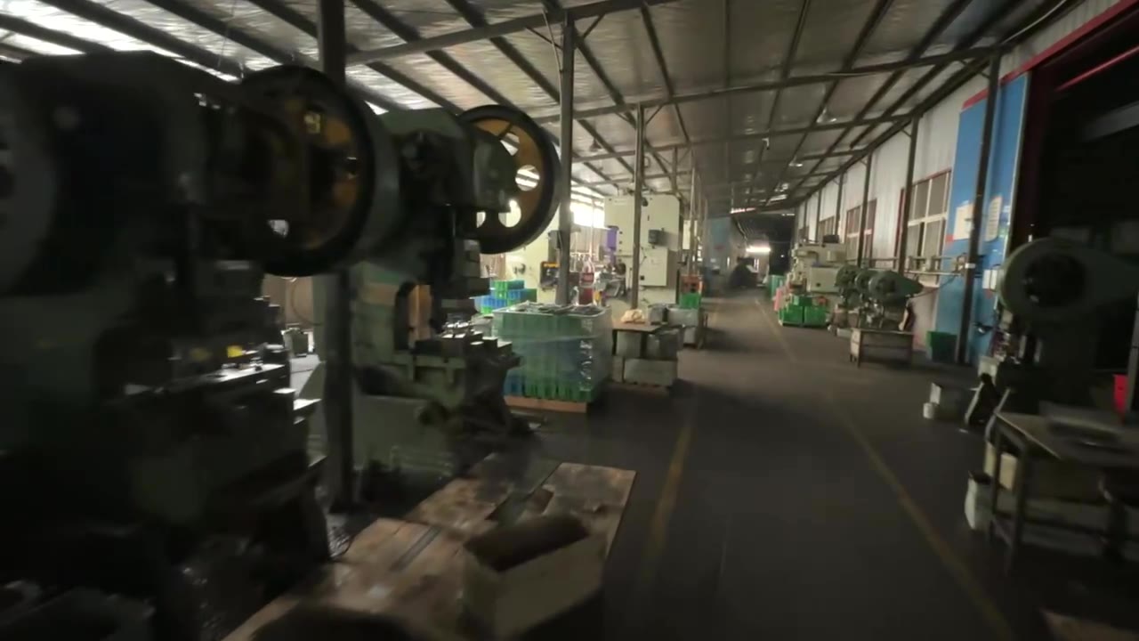 Operator running a press on the first floor of the Zhenkai Tools plant
